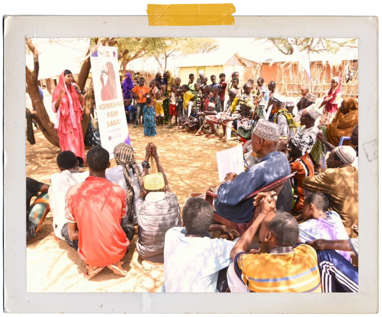 Aisha running a Community Dialogue